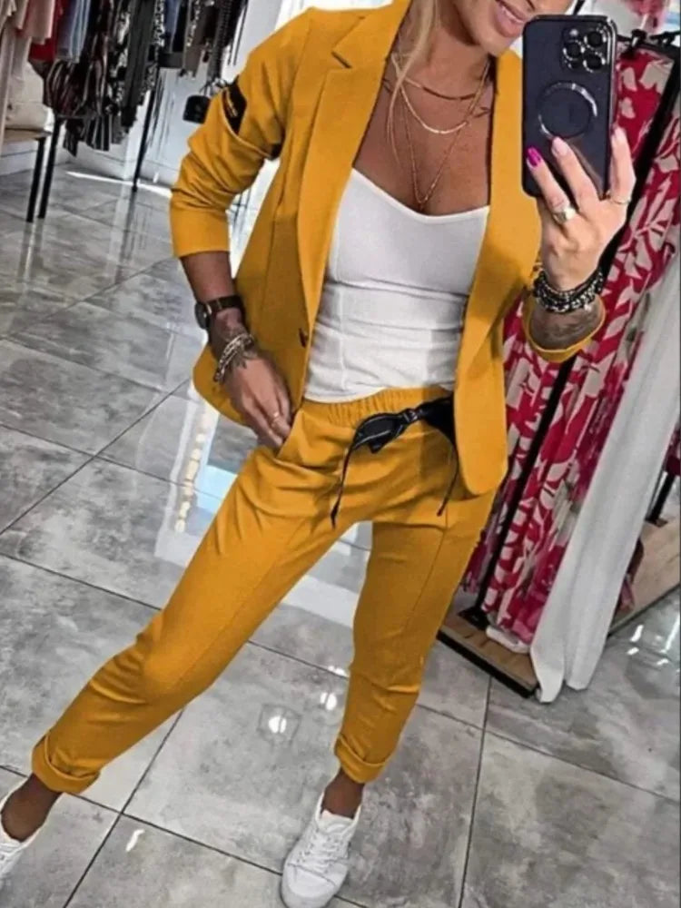 Zestaw damski: sweter zapinany na guziki i spodnie